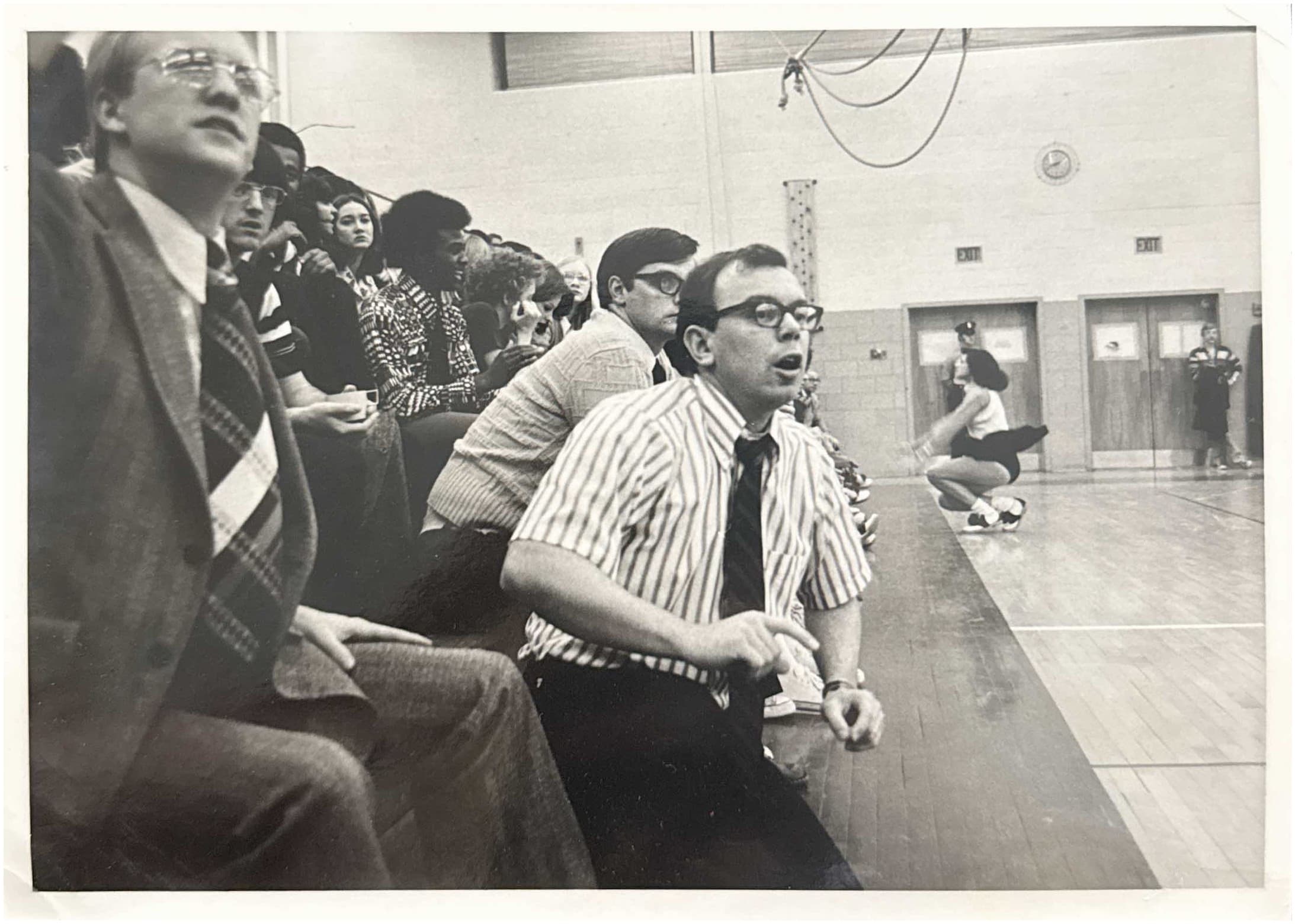 Cayla's grandfather, Jan Fritz, coaching high school basketball from the sideline
